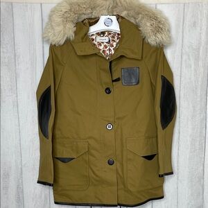 Coach Classic parka with shearling and leather trim.